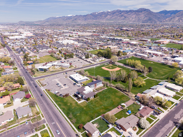 830 North 200 West Logan, UT 84321 - Photo 6 of 7 Aerial overview of property's location featuring a mountain backdrop and nearby suburban area