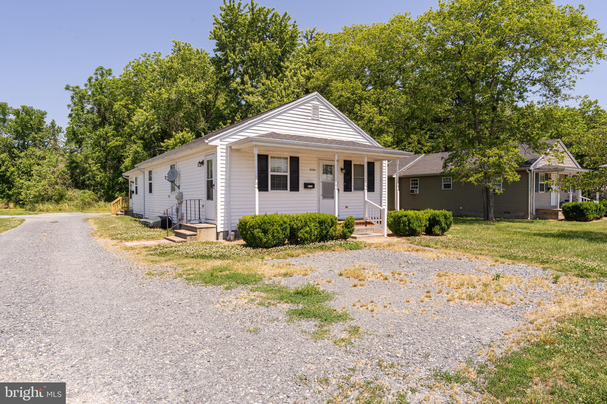 30704 Hampden Avenue Princess Anne, MD 21853 - Photo 2 of 31 a front view of a house with a yard and trees