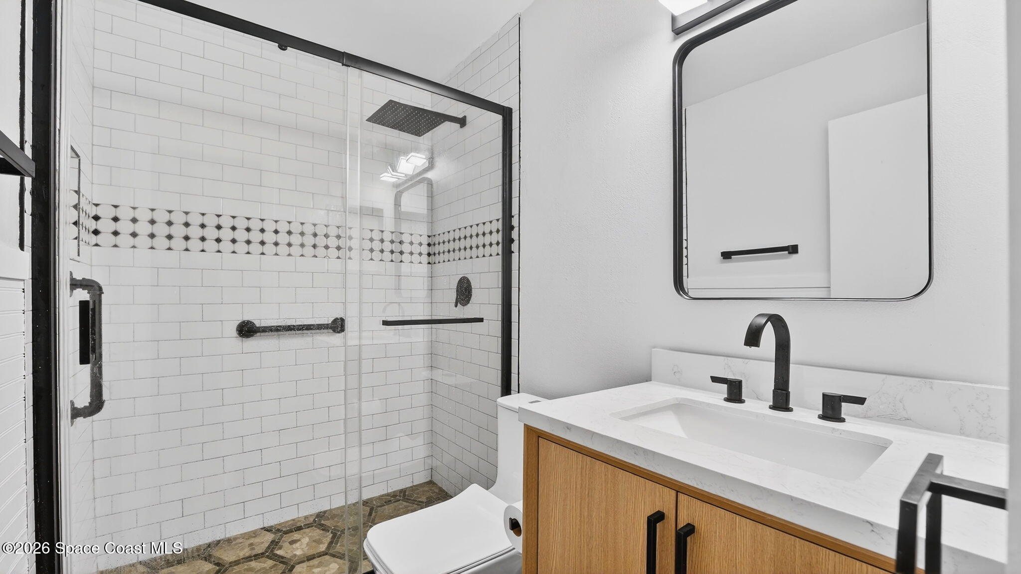 6398 Cable Avenue Cocoa, FL 32927 - Photo 20 of 30 a bathroom with a sink toilet and shower