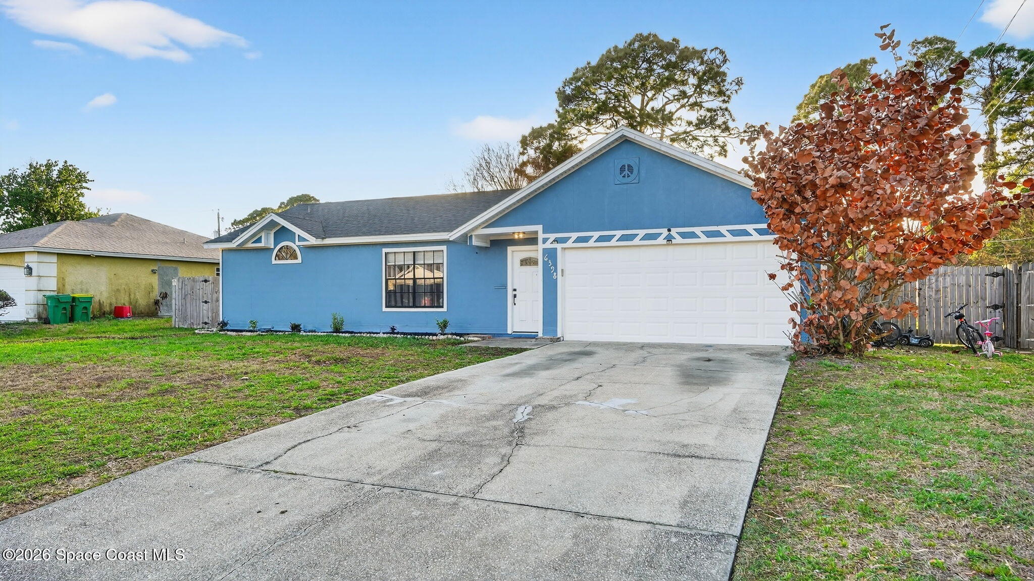 6398 Cable Avenue Cocoa, FL 32927 - Photo 3 of 30 a view of a big house with a yard