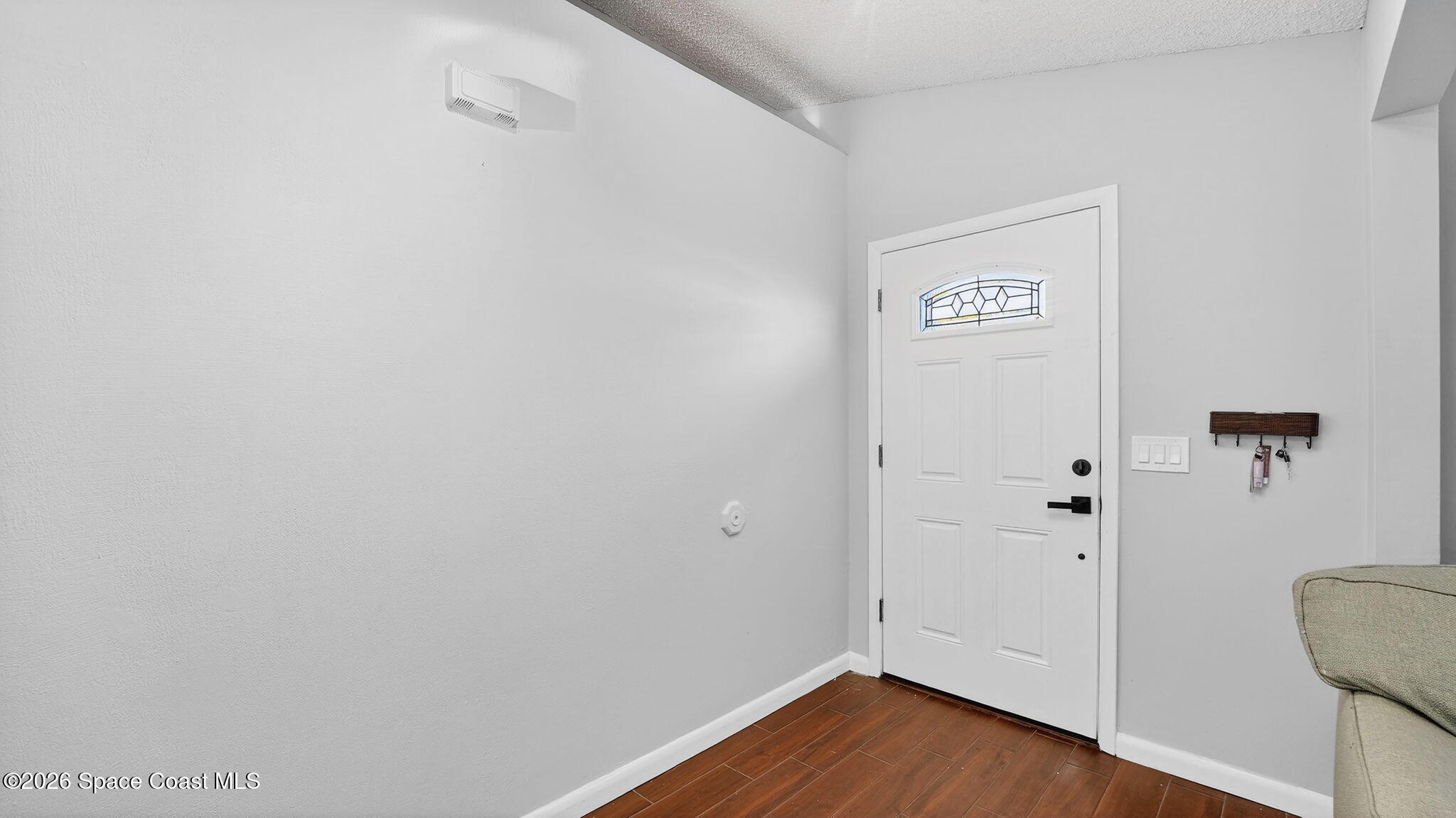 6398 Cable Avenue Cocoa, FL 32927 - Photo 4 of 30 a view of a hallway with wooden floor