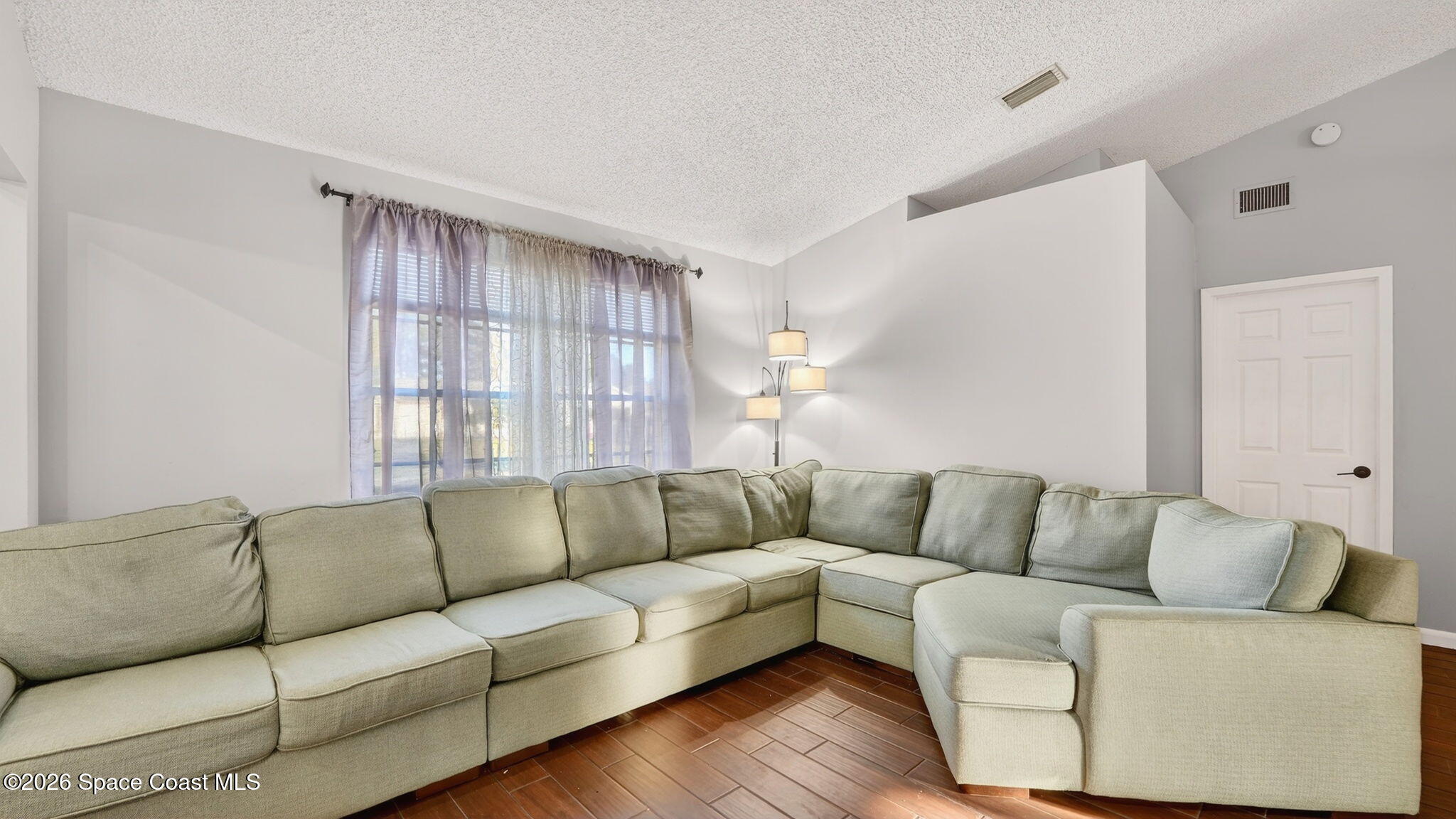 6398 Cable Avenue Cocoa, FL 32927 - Photo 5 of 30 a living room with furniture and a couch