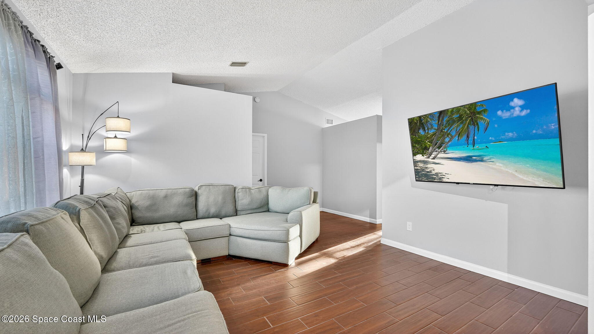 6398 Cable Avenue Cocoa, FL 32927 - Photo 6 of 30 a living room with furniture and painting on the wall