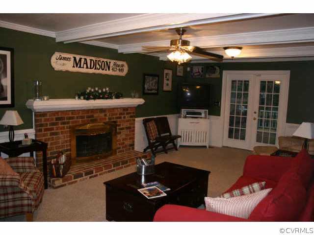 12800 Rivers Bend Road Chester, VA 23836 - Photo 4 of 10 a living room with furniture and a fireplace