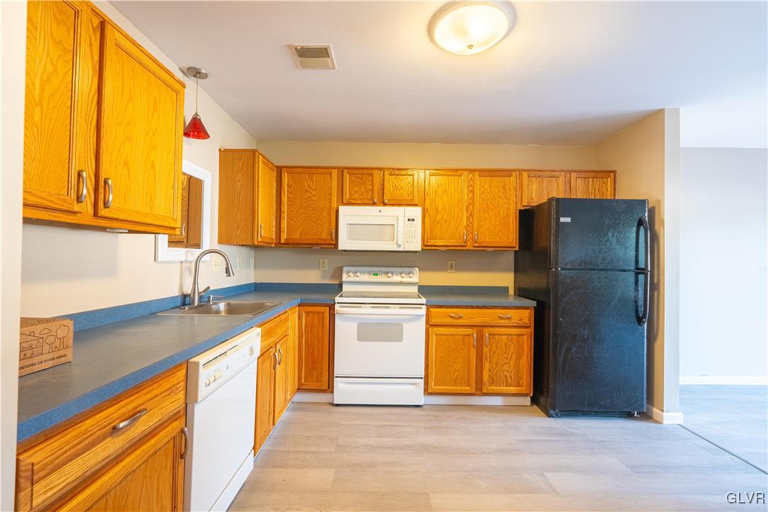 2512 Penns Ridge Boulevard Easton, PA 18040 - Photo 11 of 17 a kitchen with stainless steel appliances granite countertop a refrigerator and a sink