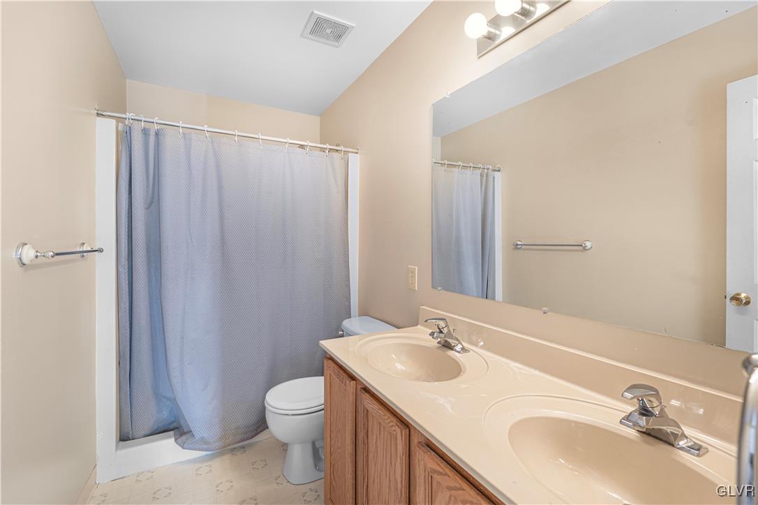 2512 Penns Ridge Boulevard Easton, PA 18040 - Photo 14 of 17 a bathroom with a granite countertop sink toilet and shower