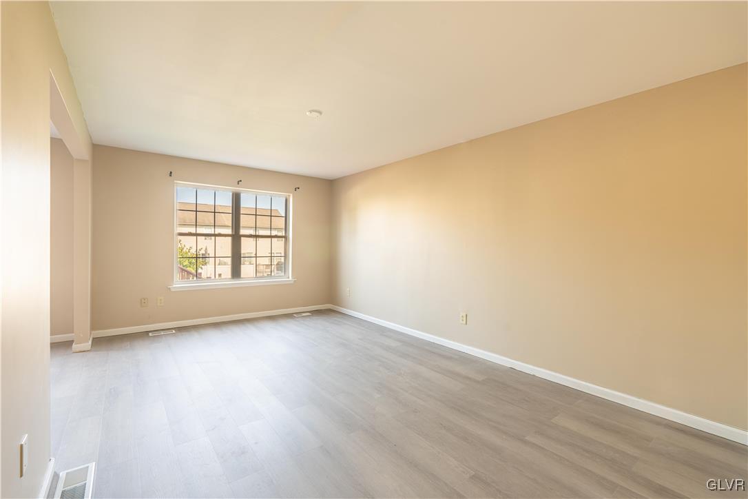 2512 Penns Ridge Boulevard Easton, PA 18040 - Photo 9 of 17 an empty room with wooden floor and windows