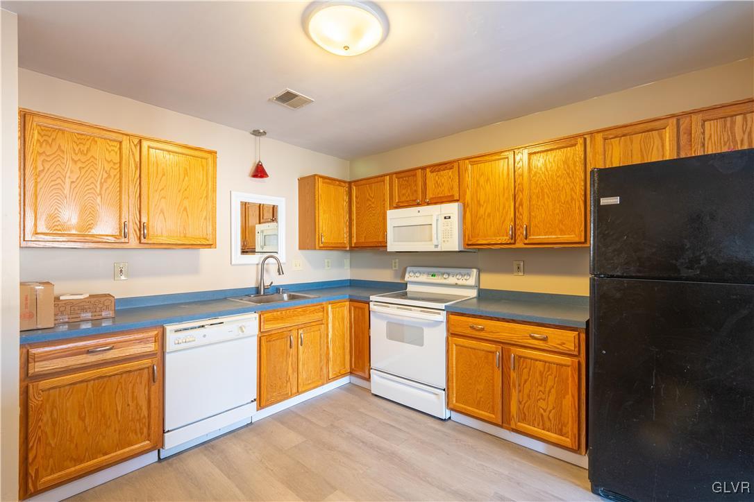 2512 Penns Ridge Boulevard Easton, PA 18040 - Photo 10 of 17 a kitchen with stainless steel appliances granite countertop a sink and cabinets