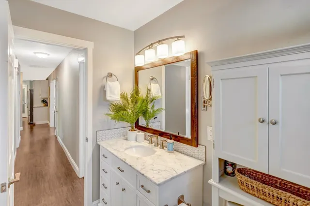 a view of a backyard with sitting area