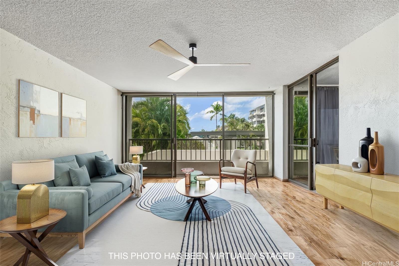 500 Lunalilo Home Road, Unit 43E Honolulu, HI 96825 - Photo 1 of 1 a living room with furniture and a large window