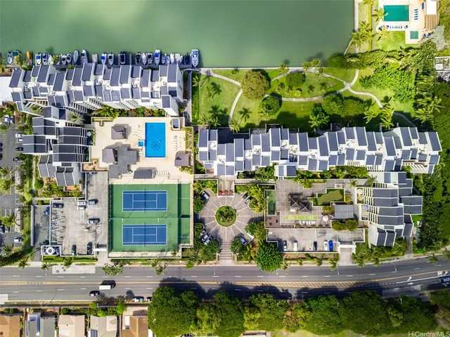 a building exterior with palm trees