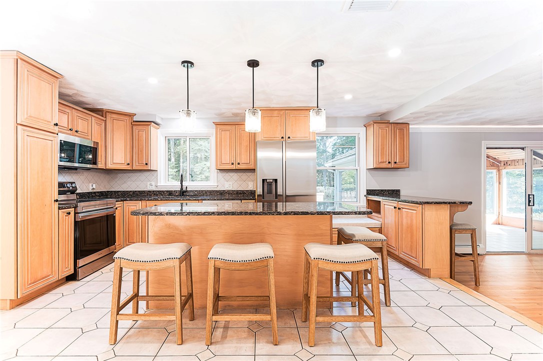 680 Fletcher Road North Kingstown, RI 02852 - Photo 7 of 41 Kitchen open to dining room and Family room. Granite counters and stainless appliances