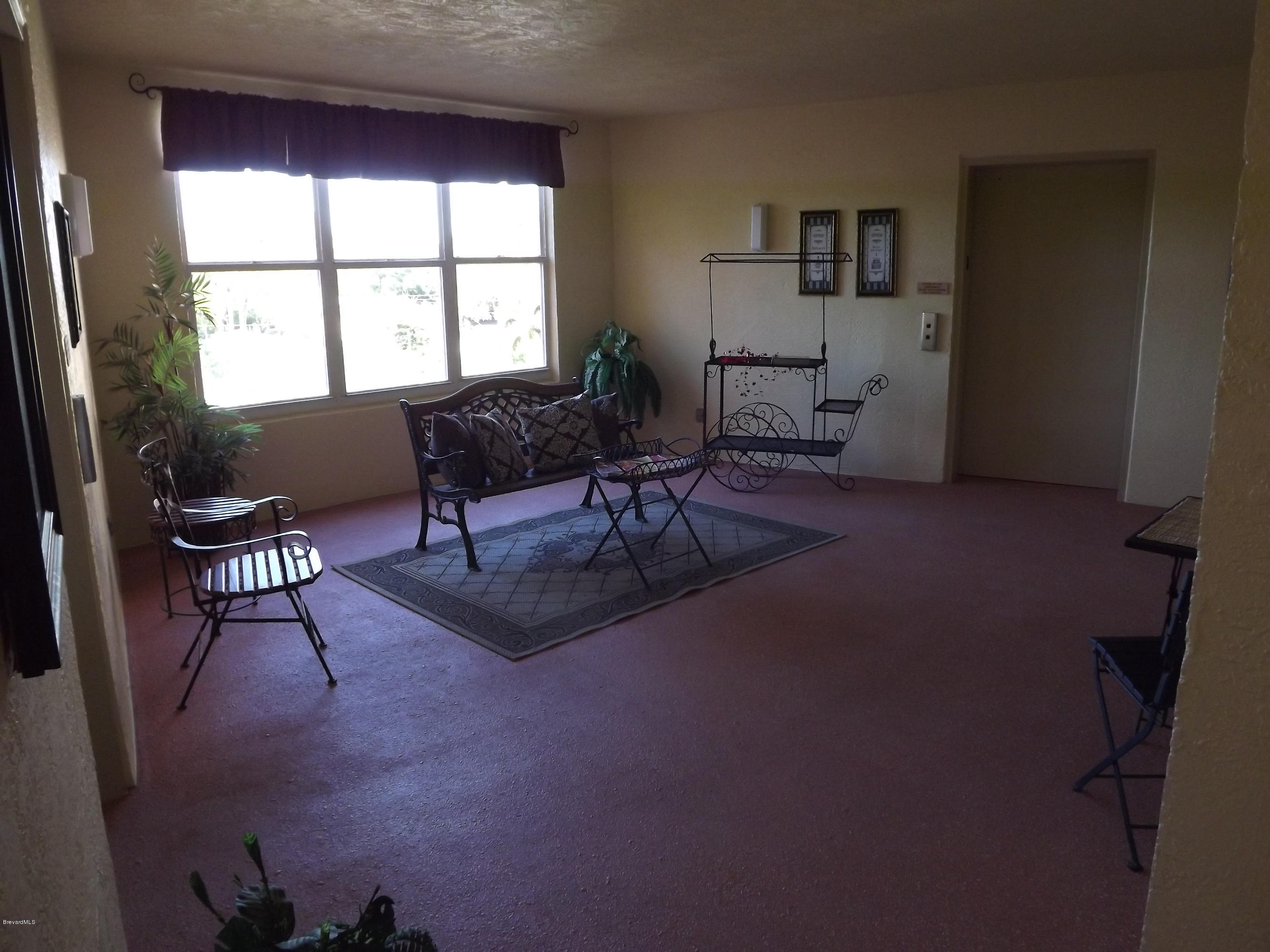 102 Riverside Drive, Unit 404 Cocoa, FL 32922 - Photo 4 of 29 Breeze Way Sitting Area