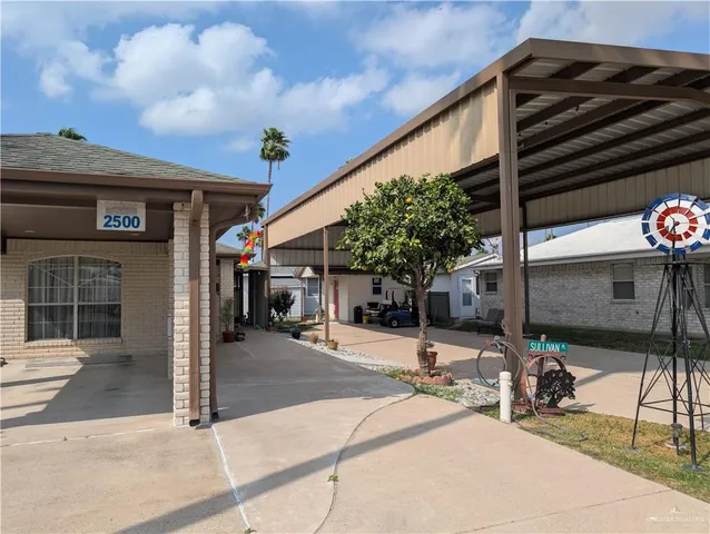 a view of a chairs and table in the patio