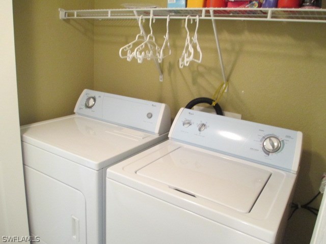 13581 Eagle Ridge Drive, Unit 1414 Fort Myers, FL 33912 - Photo 15 of 15 a utility room with dryer and washer
