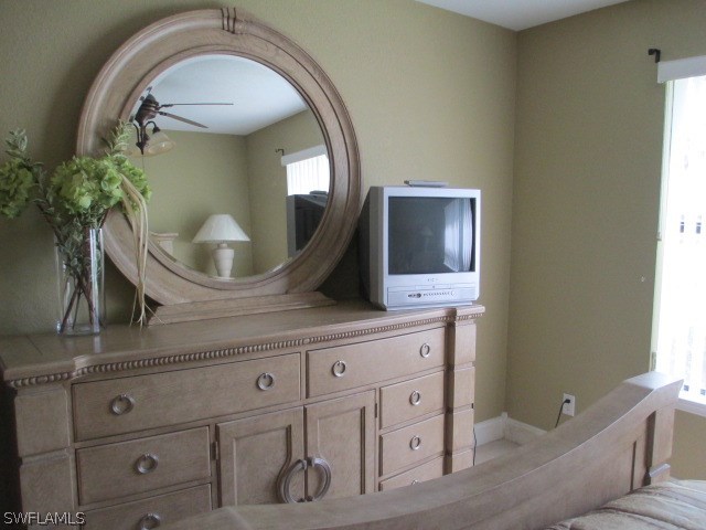 13581 Eagle Ridge Drive, Unit 1414 Fort Myers, FL 33912 - Photo 3 of 15 a bathroom with a sink mirror and vanity