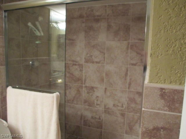 13581 Eagle Ridge Drive, Unit 1414 Fort Myers, FL 33912 - Photo 4 of 15 a bathroom with a shower