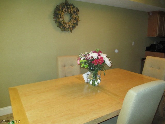 13581 Eagle Ridge Drive, Unit 1414 Fort Myers, FL 33912 - Photo 6 of 15 a view of a room with a kitchen island