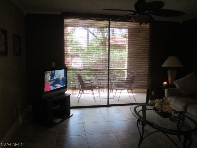 13581 Eagle Ridge Drive, Unit 1414 Fort Myers, FL 33912 - Photo 9 of 15 a living room with furniture and a flat screen tv
