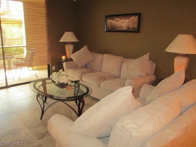 13581 Eagle Ridge Drive, Unit 1414 Fort Myers, FL 33912 - Photo 10 of 15 a living room with furniture and a window