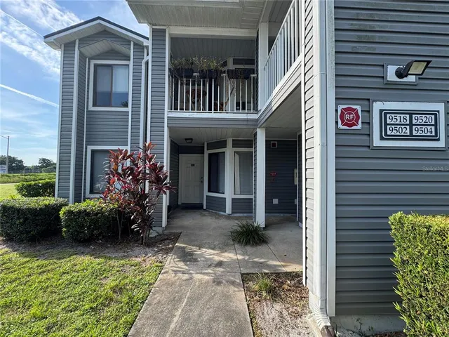 a view of a house with porch and furniture
