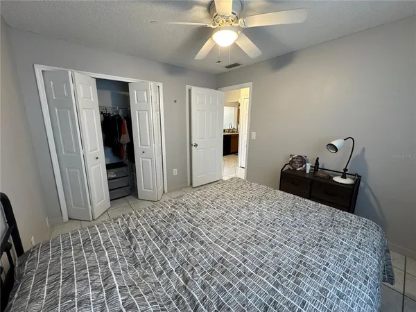 a bathroom with a double vanity sink toilet and shower