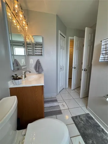 a kitchen with a sink a stove and cabinets