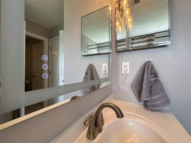 a kitchen with a refrigerator and a counter top space