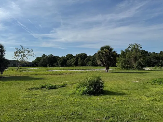 a front view of a house with sitting area
