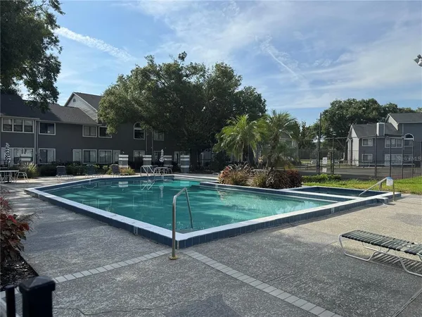 a view of a backyard with sitting area