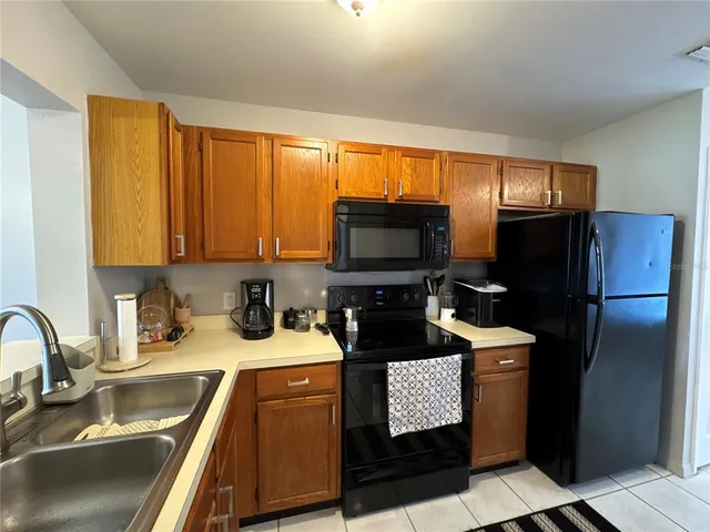 a bedroom with a bed couch and window