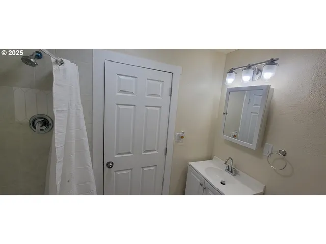 a bathroom with a sink and mirror