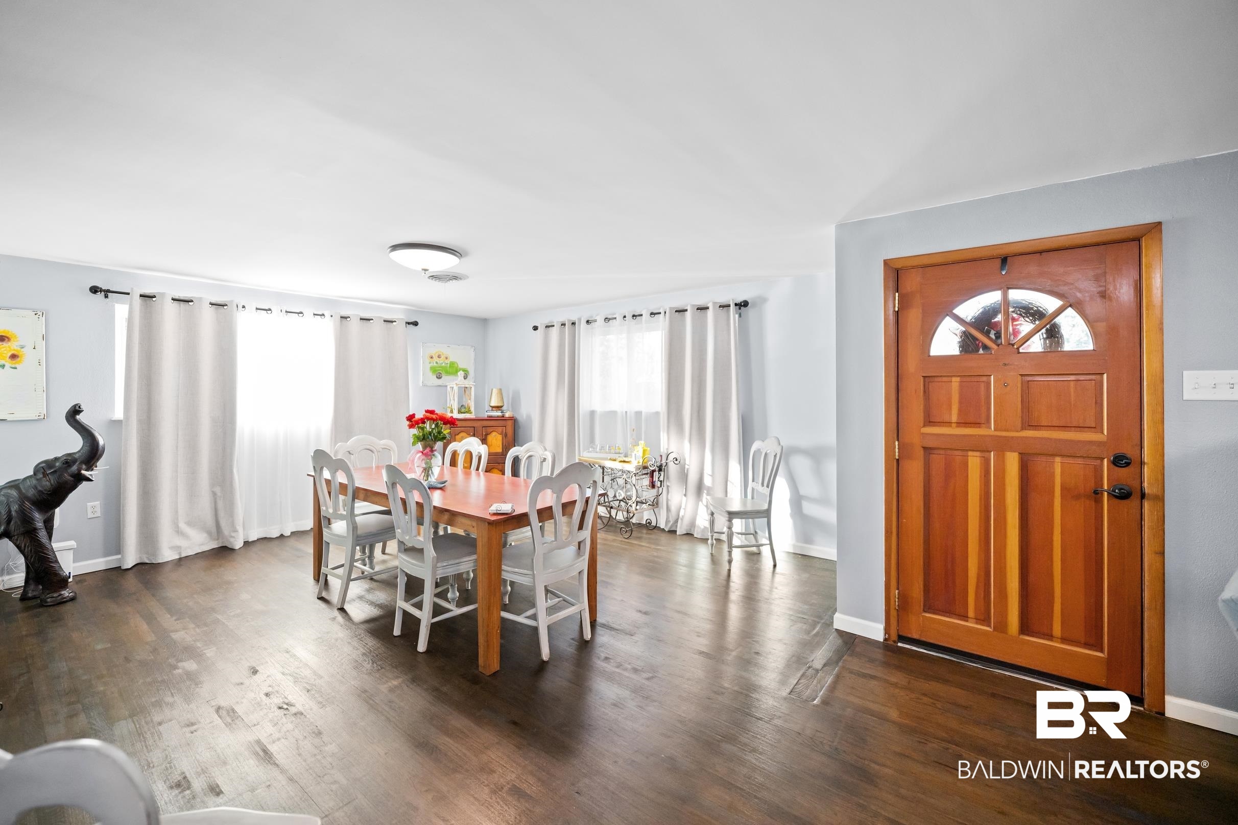 401 West Myrtle Avenue Foley, AL 36535 - Photo 7 of 39 Dining area featuring dark wood finished floors and baseboards
