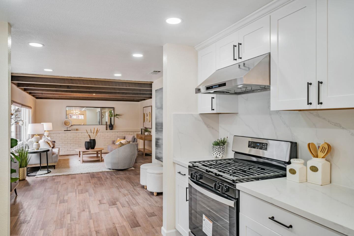 8085 Vía Zapata Dublin, CA 94568 - Photo 15 of 55 a kitchen with stainless steel appliances granite countertop a stove and a wooden floors