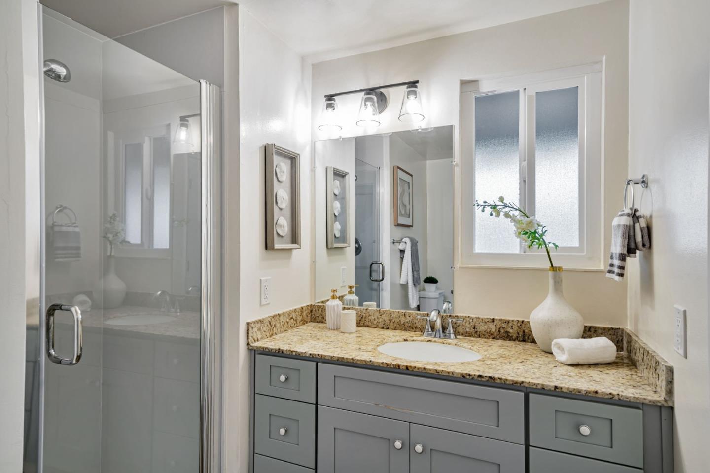 8085 Vía Zapata Dublin, CA 94568 - Photo 48 of 55 a bathroom with a granite countertop sink and a mirror