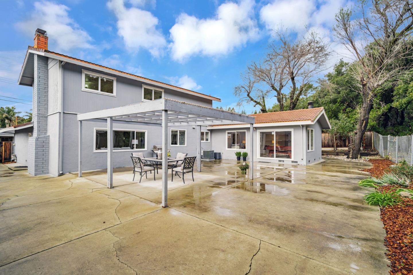 8085 Vía Zapata Dublin, CA 94568 - Photo 53 of 55 a view of a patio with table and chairs potted plants and a large tree
