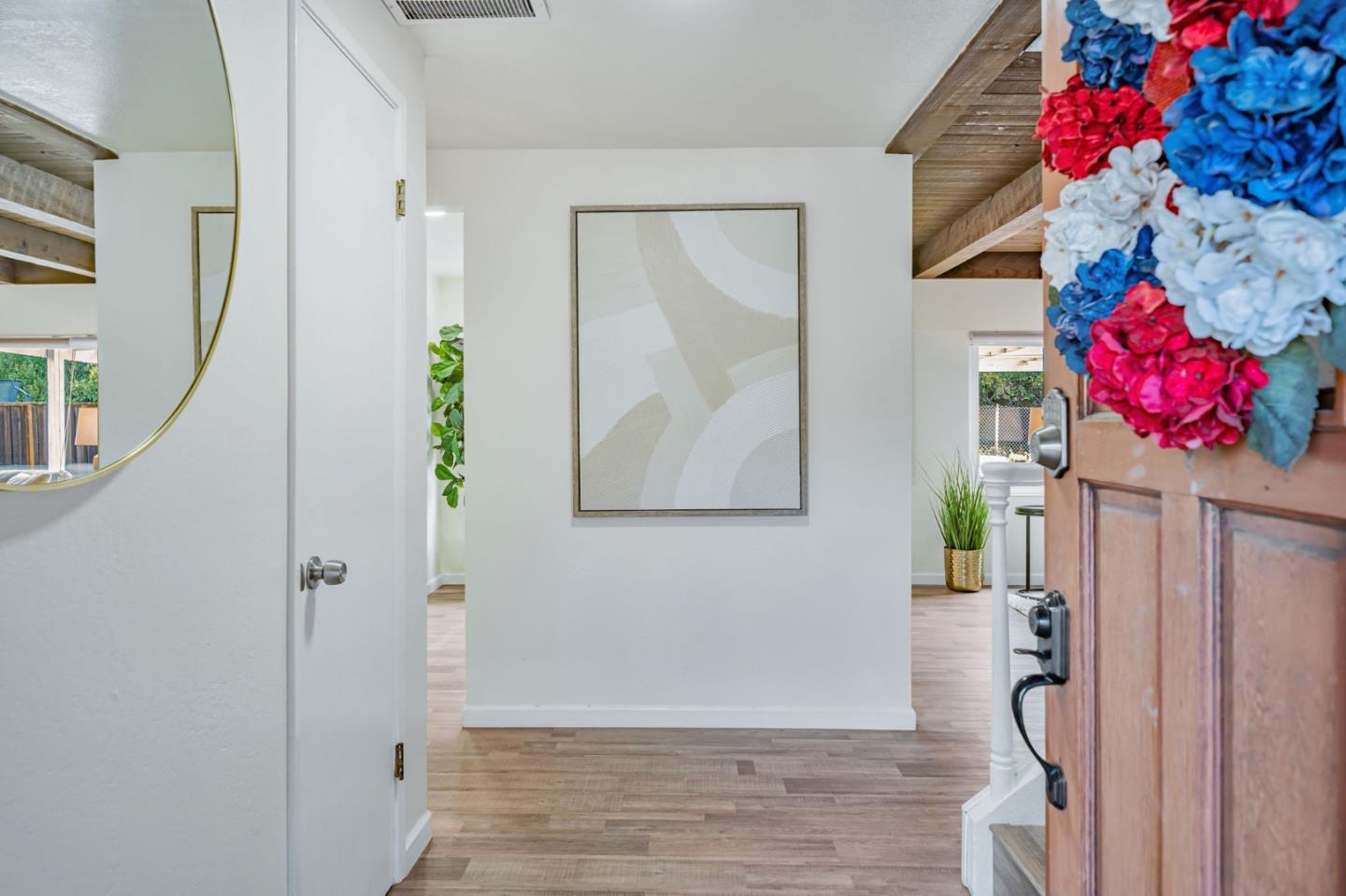 8085 Vía Zapata Dublin, CA 94568 - Photo 6 of 55 a view of a hallway with flower pot and a bookshelf