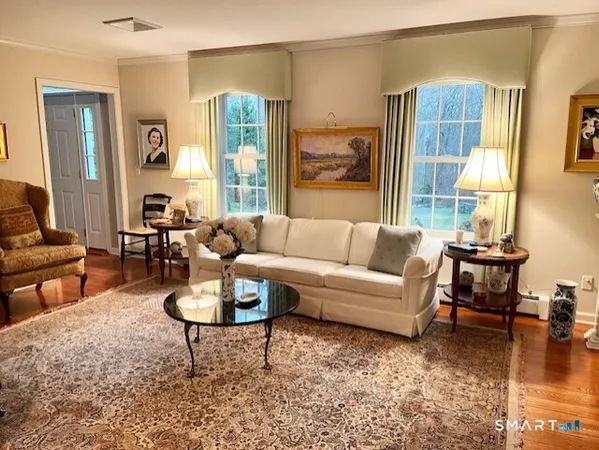 a kitchen with granite countertop a sink stove and refrigerator