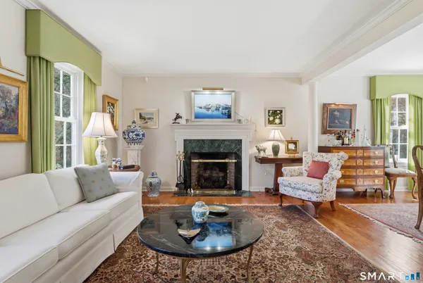 a view of backyard with swimming pool and seating space