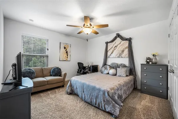 a view of walk in closet with clothes