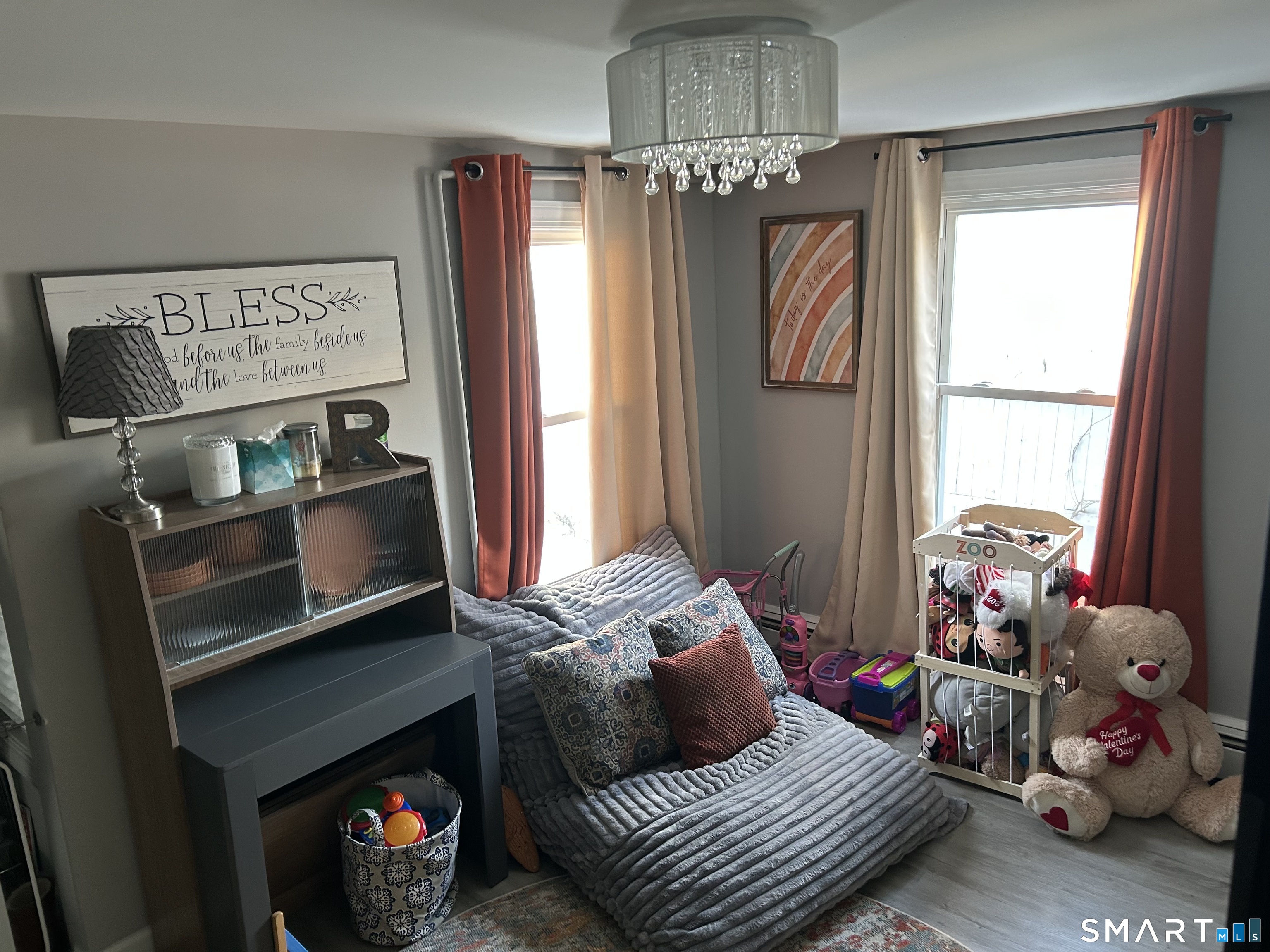146 Liberty Street Middletown, CT 06457 - Photo 5 of 11 a bedroom with a bed and a chandelier