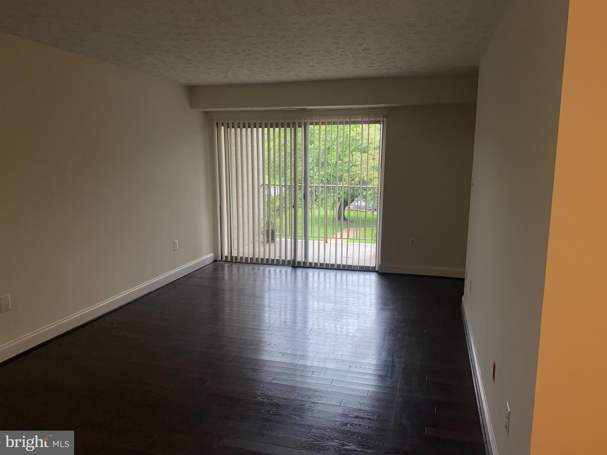 7931 Mandan Road, Unit 623 Greenbelt, MD 20770 - Photo 9 of 9 a view of wooden floor and a window in an empty room