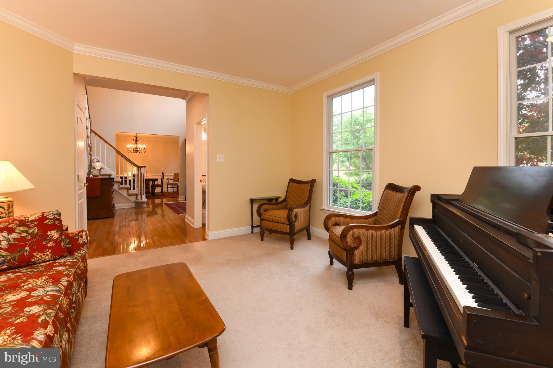 31 Millwood Drive Mickleton, NJ 08056 - Photo 18 of 62 a living room with furniture and a piano