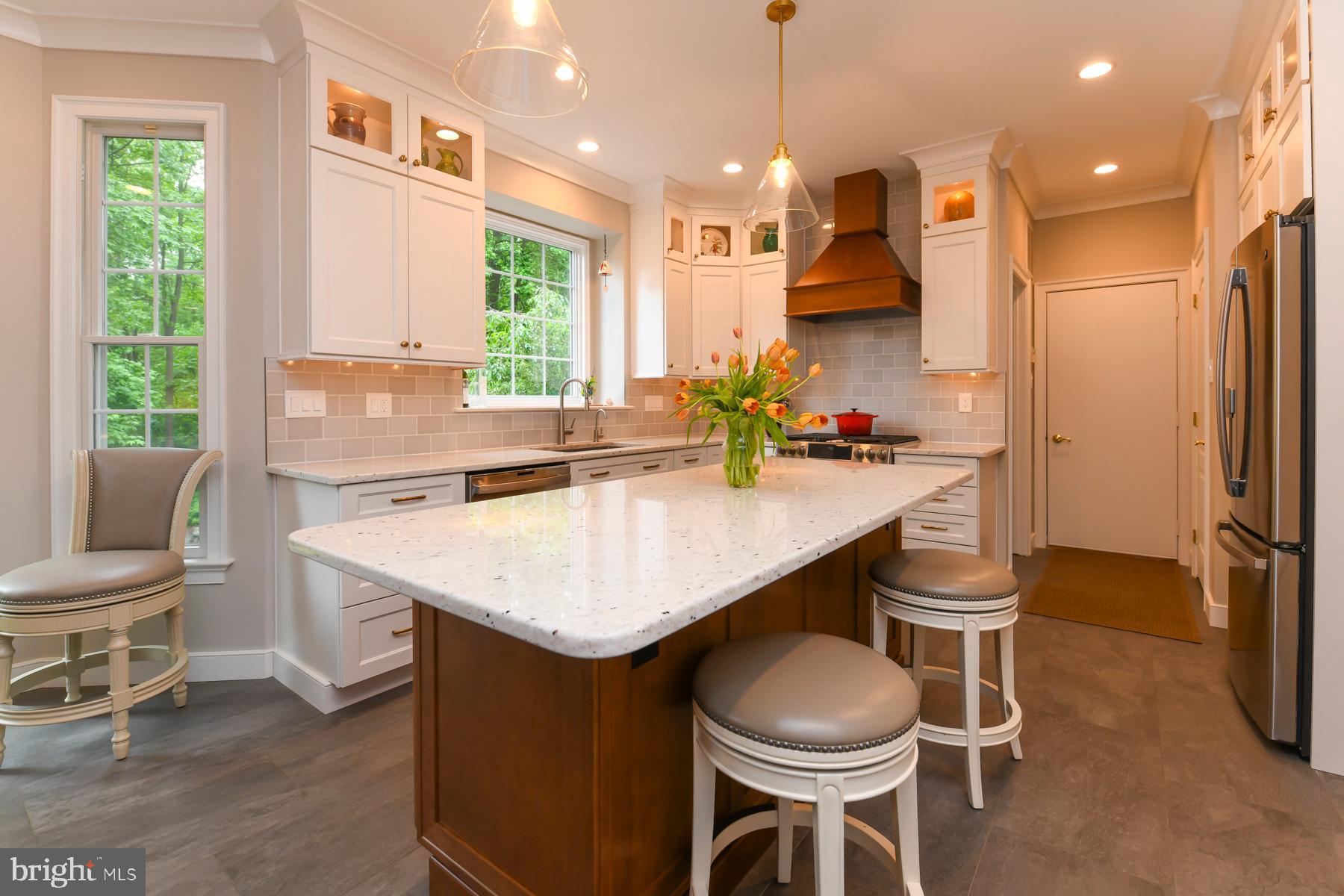 31 Millwood Drive Mickleton, NJ 08056 - Photo 19 of 62 a kitchen with a table chairs sink and cabinets