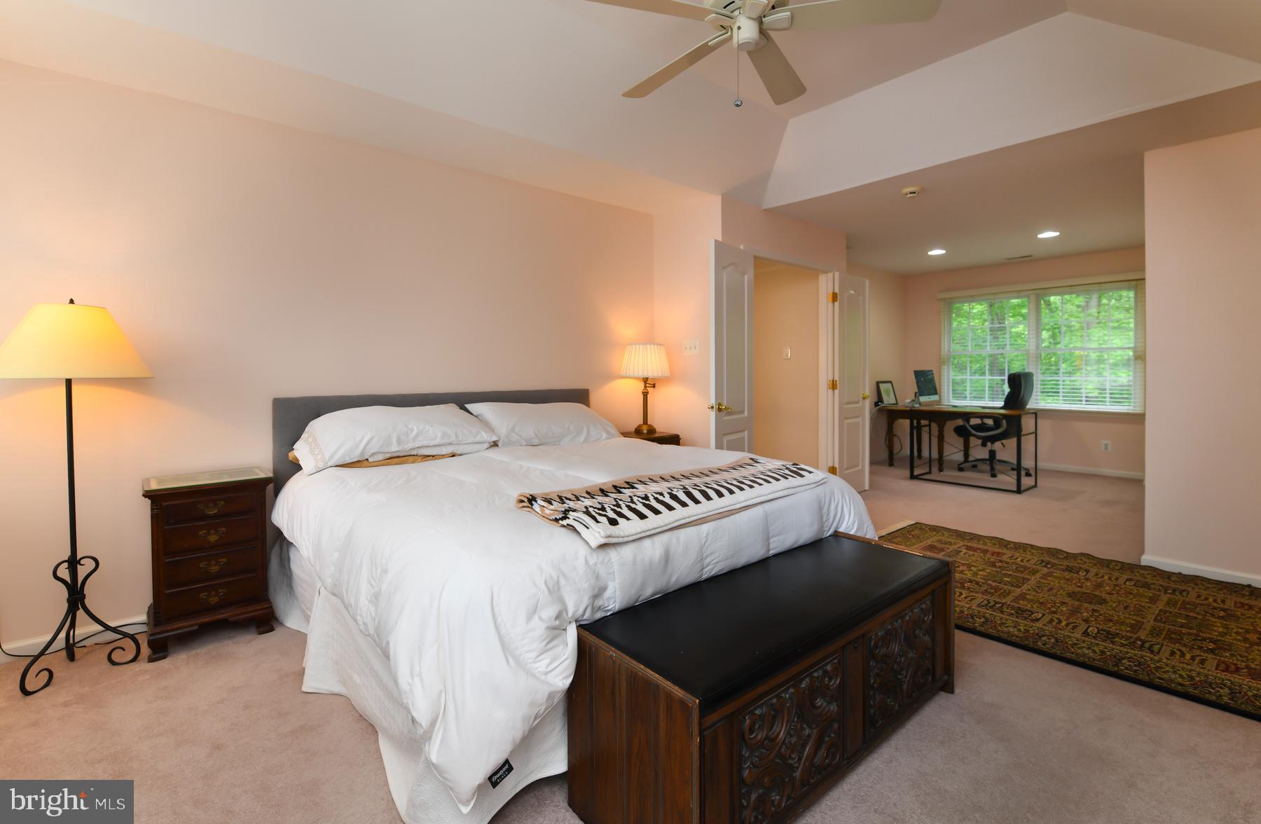 31 Millwood Drive Mickleton, NJ 08056 - Photo 39 of 62 a bedroom with a bed and a chandelier