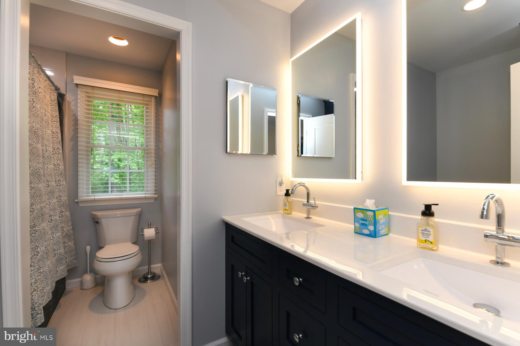 31 Millwood Drive Mickleton, NJ 08056 - Photo 48 of 62 a bathroom with a double vanity sink toilet and mirror
