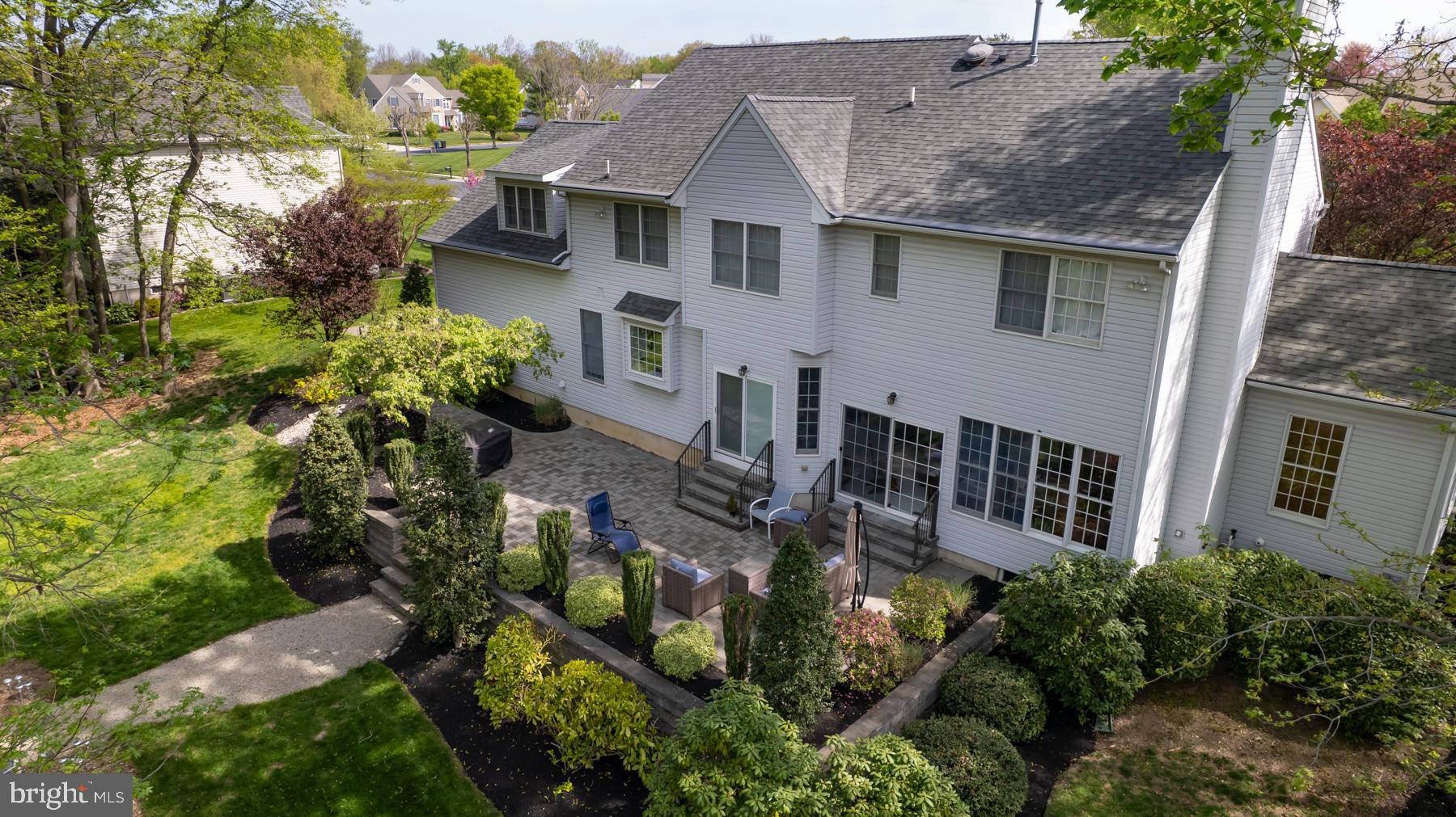 31 Millwood Drive Mickleton, NJ 08056 - Photo 53 of 62 a aerial view of a house with a yard and potted plants