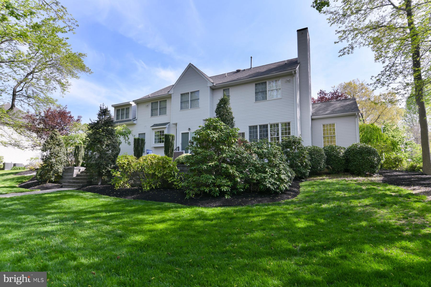31 Millwood Drive Mickleton, NJ 08056 - Photo 56 of 62 a front view of a house with a garden