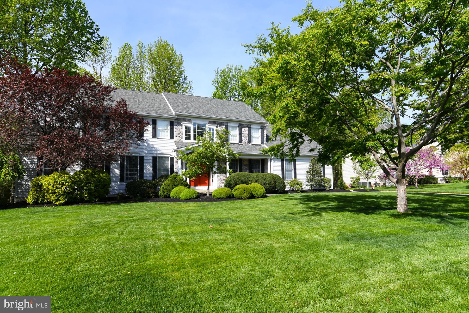 31 Millwood Drive Mickleton, NJ 08056 - Photo 6 of 62 a view of a house next to a big yard and large trees