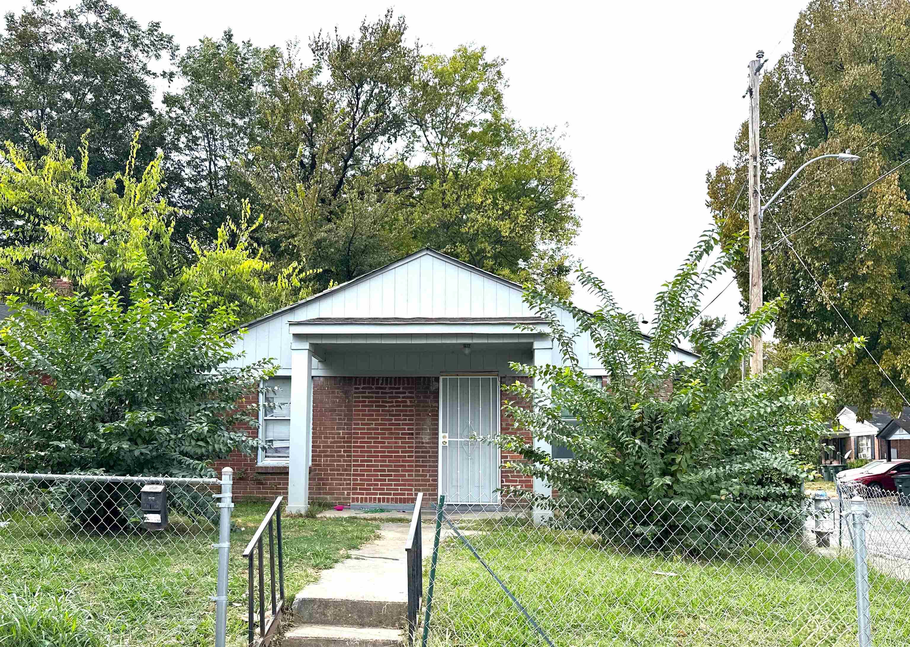1103 Springdale Street Memphis, TN 38108 - Photo 2 of 2 a front view of a house with plants